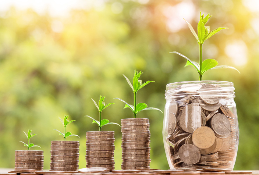 Money growing from jar