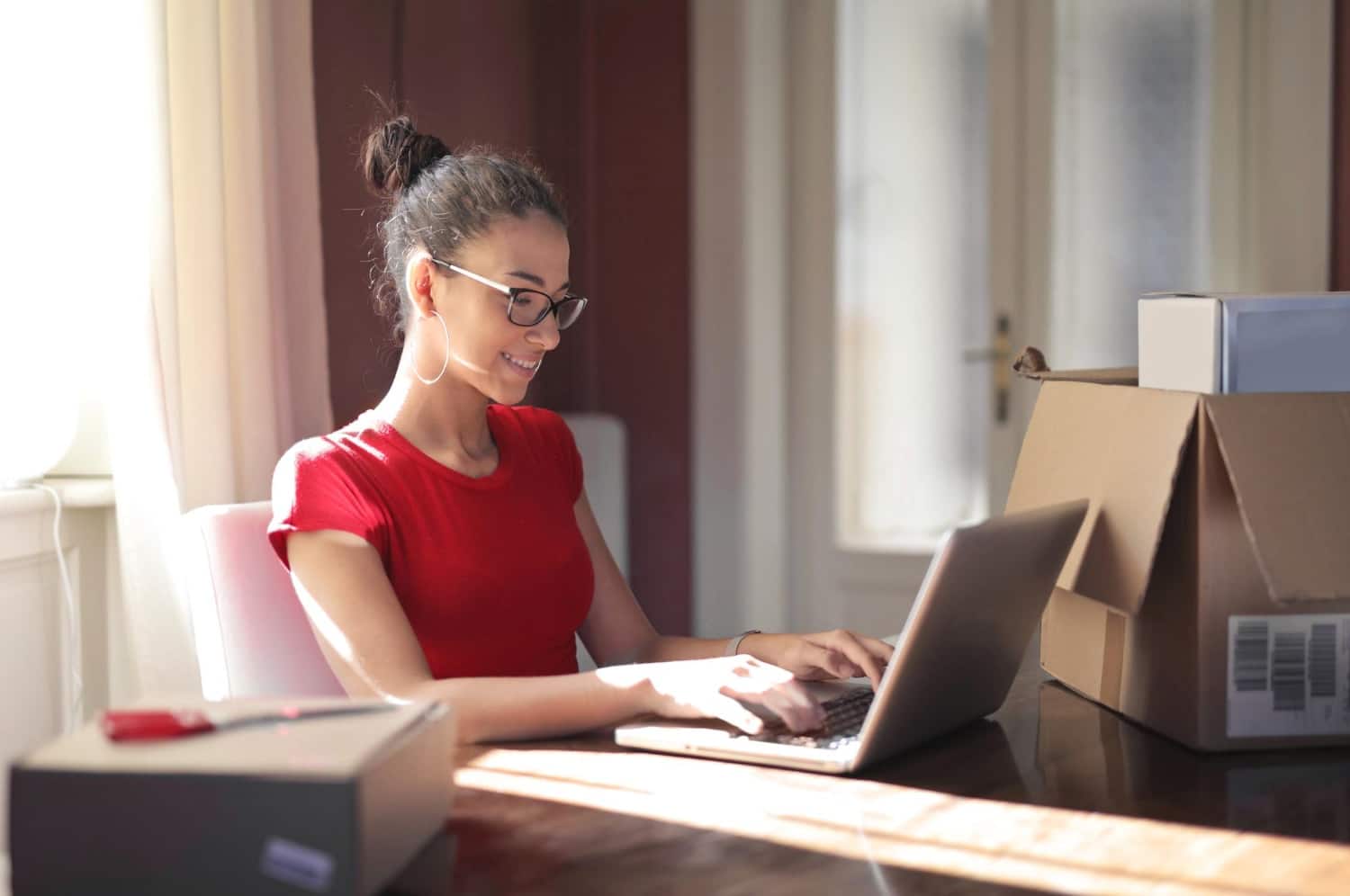 woman checking her product library to track performance